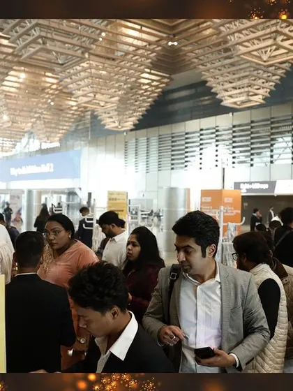 The entrance to the exhibition hall is filled with an electrifying energy as thousands of attendees arrive, ready to explore.