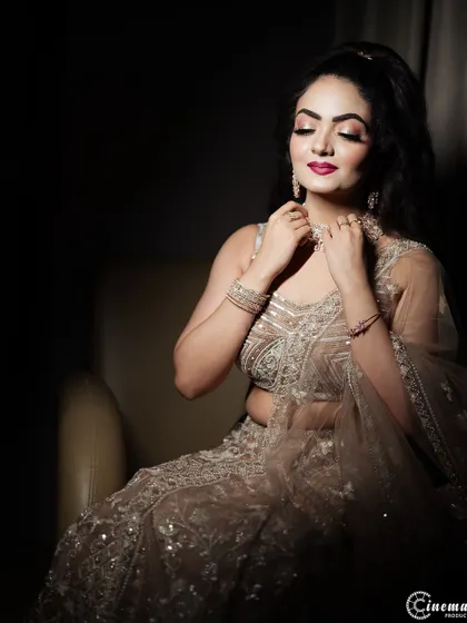 A close-up shot focusing on the bride's elegant pose and the details of her diamond necklace.