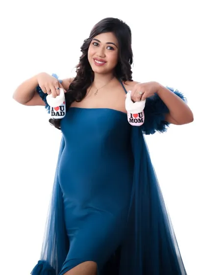 A collection of artistic shots featuring a gorgeous royal blue gown, from full-length portraits to creative close-ups on the fabric and bump.