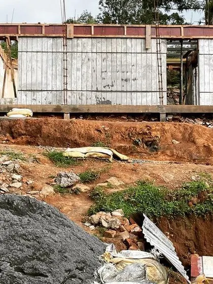 Exploring a wood-textured concrete wall during the construction of the TARA resort. This technique allows us to achieve the warm look of wood with the durability of concrete.