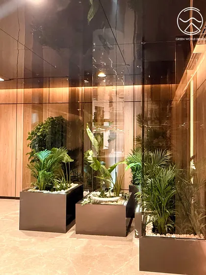 Planters strategically placed in a common area at the Hyderabad office. The composition of different plant heights and textures adds visual interest and contributes to a healthier indoor ecosystem.