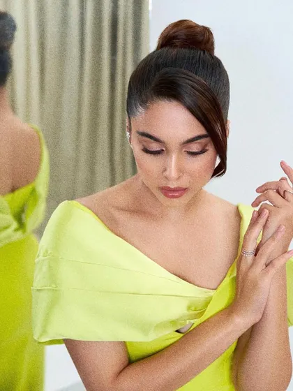 A close-up of the elegant top knot and makeup that completed this award-winning look.