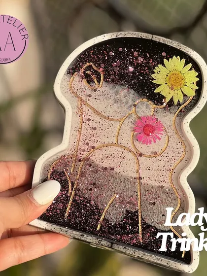 This beautiful lady trinket dish was part of a custom Rakhi hamper. It's perfect for holding small jewelry and adds an artistic touch to any space.