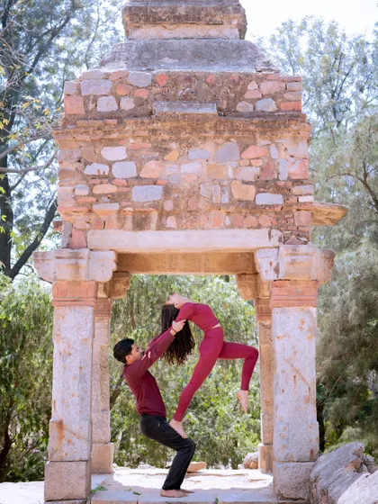 Acroyoga is more than just poses; it's an exercise in trust and communication. In my team-building workshops, I guide partners through foundational lifts like this, creating a unique and memorable bonding experience.