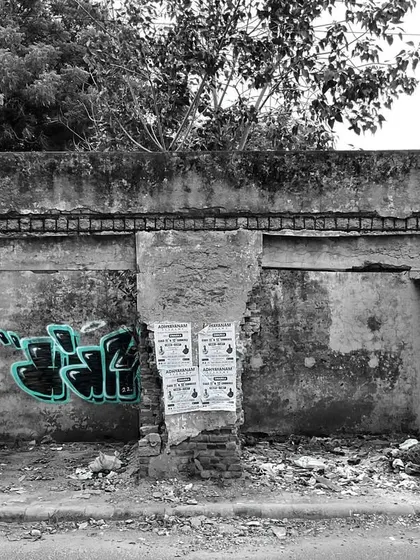 A monochrome photo with a splash of color on my graffiti throw-up. Abandoned spots are the perfect canvas for practice and experimentation.