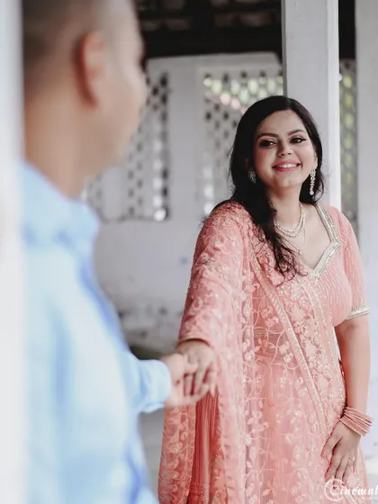 A simple gesture of holding hands, but her expression shows so much warmth and happiness. This is a beautifully candid moment captured from a distance, preserving its authenticity.
