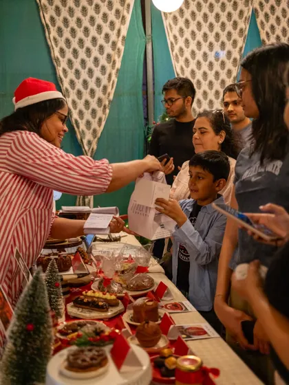 For us, it's all about community. This moment from a Christmas pop-up, sharing a treat with a young customer, captures the joy and personal connection that is at the heart of Maska Bakery. We love meeting you and being part of your celebrations.