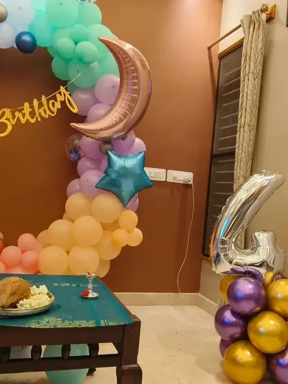 A full view of the moon and stars ring decoration for a fourth birthday. The arrangement is perfect for creating a beautiful photo corner in your home.