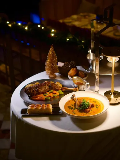 A table set for our festive Christmas menu. The dishes, like the confit duck curry and roast lamb, are designed to be shared and enjoyed together.