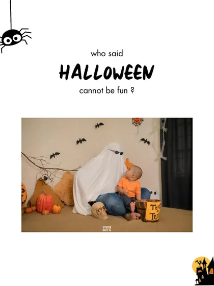Who said Halloween can't be fun? A baby plays with a friendly ghost (dad in disguise!).
