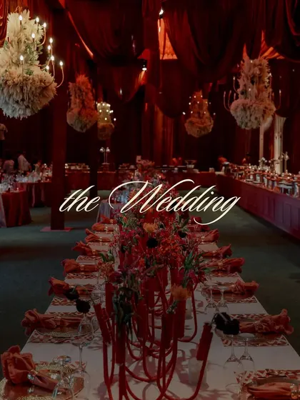 A title card for 'the Wedding', set against the backdrop of the opulent red decor, signaling the main event.