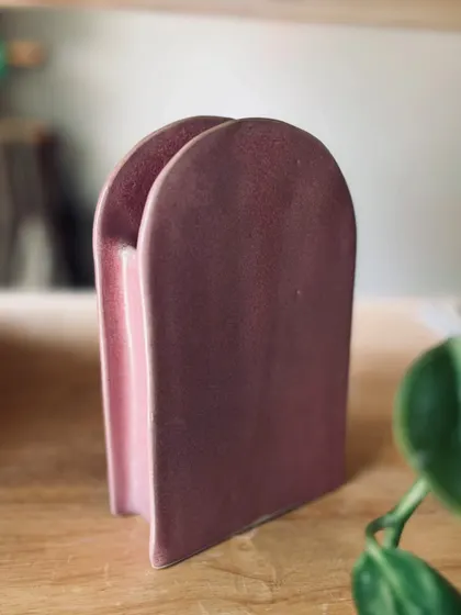 This pink, arched vase was created using slab-building techniques. It's amazing to see how students interpret the same prompts in unique ways.
