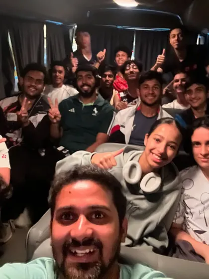 All smiles after a hard day of training. The team spirit and camaraderie are evident as our players and the Saudi team travel together.
