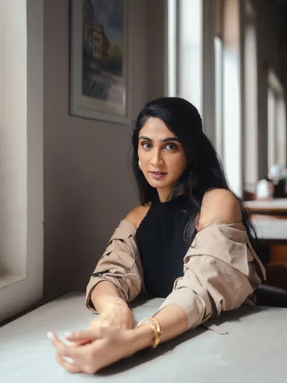 Another portrait from the same series, showing how a simple gold bracelet can add a touch of elegance to a casual outfit.