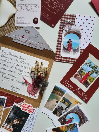 A closer look at a birthday hamper, featuring a wax-sealed letter and custom cards. Every detail is crafted with love.