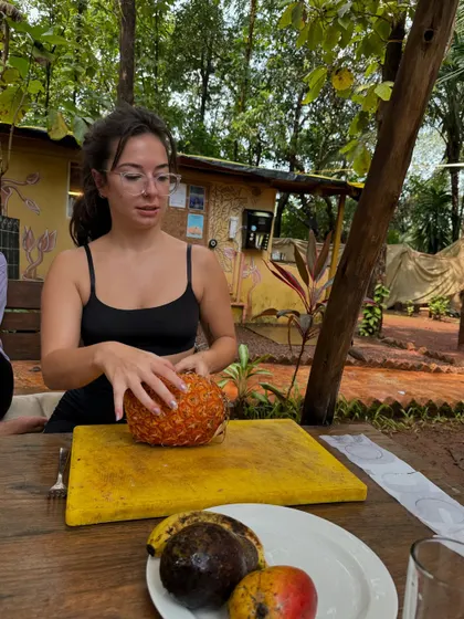 A participant helps to prepare fresh fruit. We often incorporate simple, mindful food prep into our days, connecting us to what we eat.