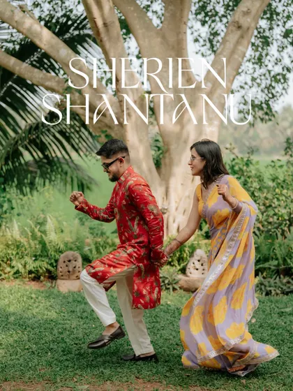 A dynamic shot of the couple dancing in a garden, capturing their movement and joy.