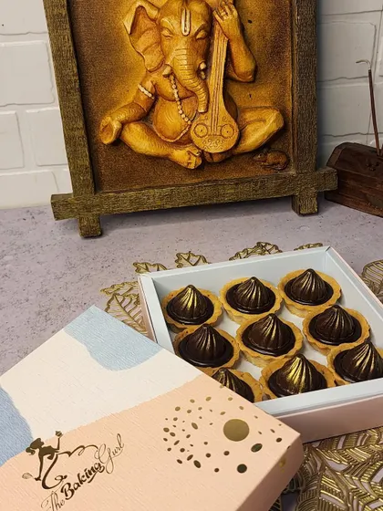 Here is another view of my limited-edition chocolate modak tarts. They come in my signature pink and blue packaging, making them a beautiful gift for friends and family during the festival.