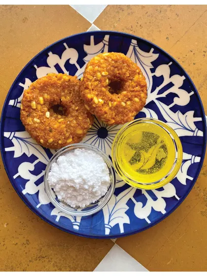 Cheli ke Dhokle served with ghee and powdered sugar, a simple and delicious dish from Rajasthan.