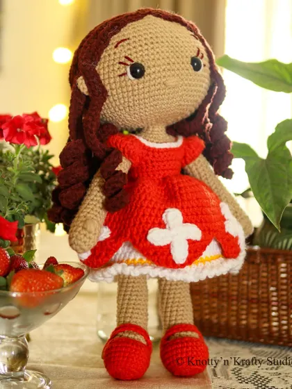 Lily the Doll, my first new creation of the year. I find that her cheerful red dress is the perfect antidote to any Monday blues.