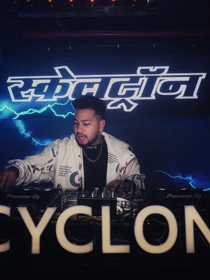 Another angle from my set at Cyclone, Nagpur, with the club's branding and cool blue lighting.