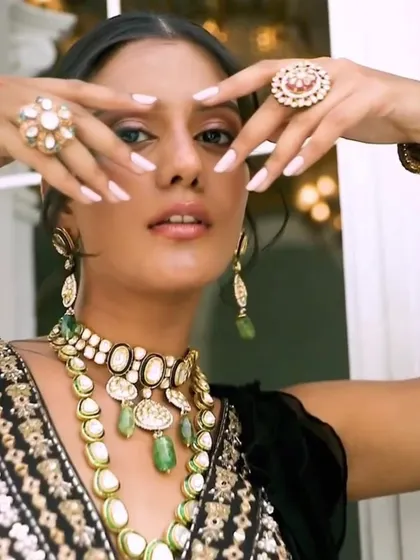 A candid-style shot from the Om Jewellers campaign, highlighting the beautiful polki rings and bangles. It shows how every piece in a set contributes to the overall look.