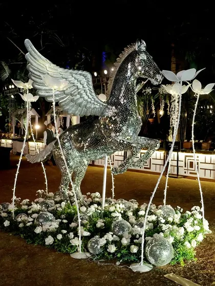 A statement decor piece that embodies our brand. This life-sized, winged horse covered in disco ball mirrors was a showstopper, adding a touch of myth and a lot of sparkle to the Sangeet night.