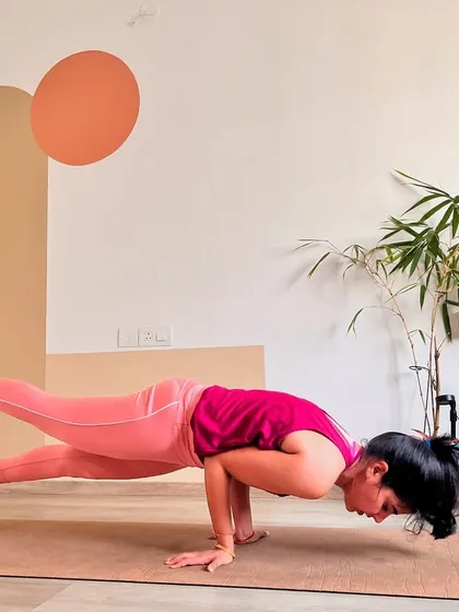 Another attempt at the Peacock Pose, showing the constant adjustments in alignment. The journey to mastering a pose involves many of these "almost there" moments.