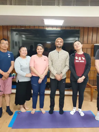 A group of international students with their instructor. We foster a supportive learning environment where students feel comfortable asking questions and deepening their understanding.