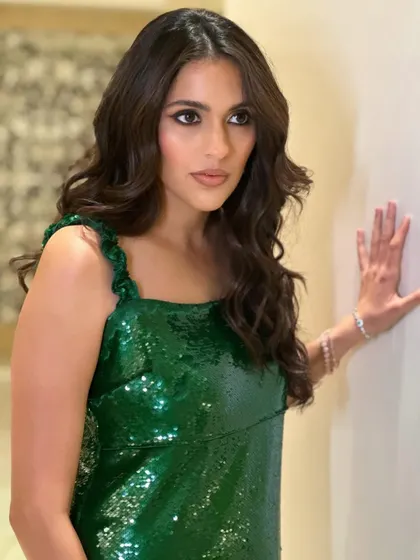 The full party vibe. Shloka looking effortlessly chic and ready to celebrate in her green sequin Ganni dress.