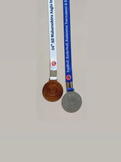A close-up of the silver and bronze medals won by Avni Arlekar in Pune, representing her success in both U17 and U19 categories.