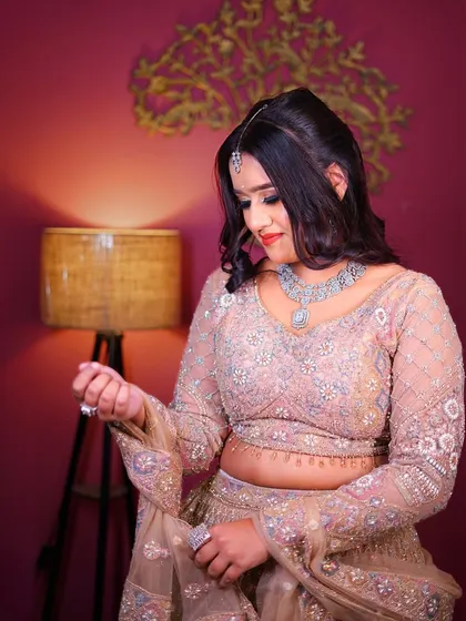 A close-up of the pastel peplum lehenga, showing the delicate details of the outfit.