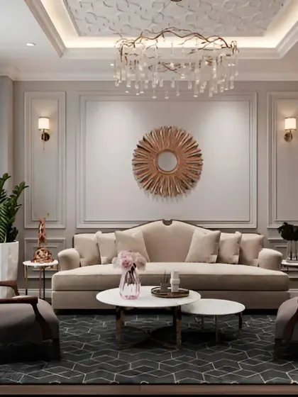 The living area centered around a plush beige sofa and a statement sunburst mirror, creating a warm and inviting atmosphere.
