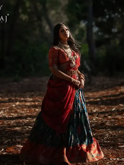 An artistic shot of the multi-colored banarasi lehenga, showcasing its rich colors and traditional design.