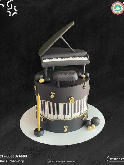 A masterpiece for a music lover. This two-tier cake features a detailed grand piano topper, piano key patterns, and golden musical notes, creating a harmonious design for a special celebration.