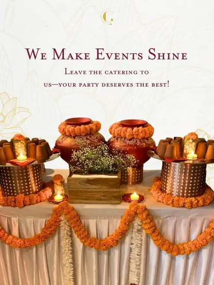 A simple yet elegant table setup for a festive celebration. The earthen pots and marigold garlands add a touch of traditional Indian charm.