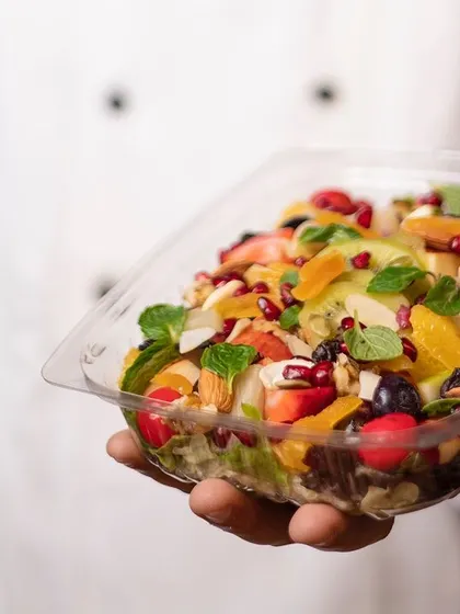 Our chef proudly presents a fresh and vibrant fruit salad, a testament to our commitment to quality and flavor.