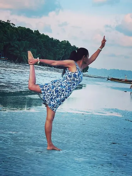 A joyful Natarajasana, or dancer's pose, in the shallow waters of a beautiful Andaman beach. The warm water and stunning scenery made this moment of balance and grace feel truly blissful.
