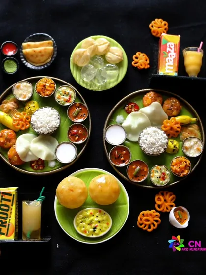 A collection of my South Indian miniatures, including full meals, poori with masala, and fruit juice.