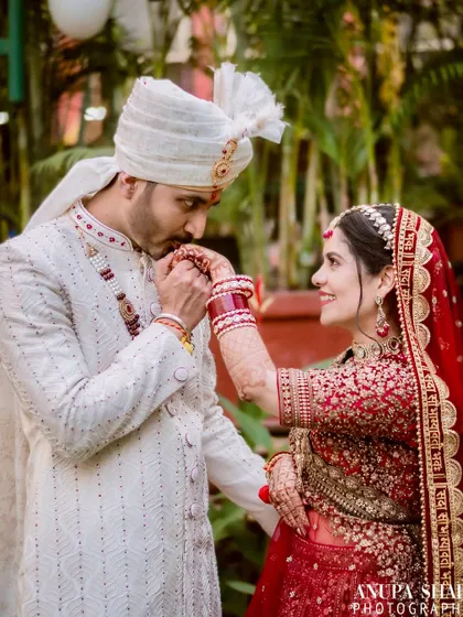 A classic romantic gesture. The groom gently kisses the bride's hand, a timeless expression of love and respect that I love to capture.