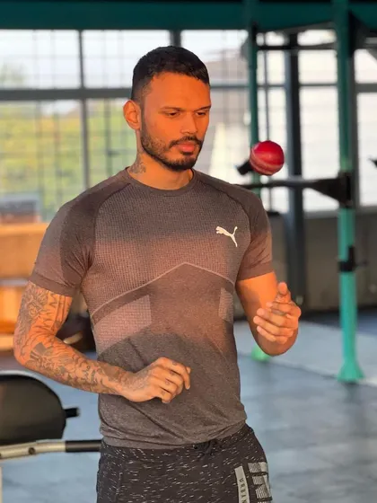 A quiet moment of focus in the gym. Hand-eye coordination and concentration are mental skills that are just as important to train as physical ones.