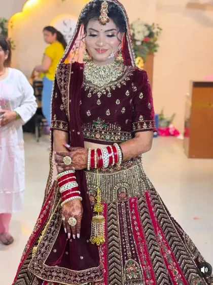 A full-length shot of a bride, showcasing how the mehndi on her hands adds to the overall grace and beauty of her wedding day look.