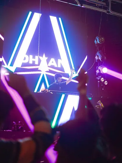 Another view of the impressive stage visuals, with the crowd's hands in the air.