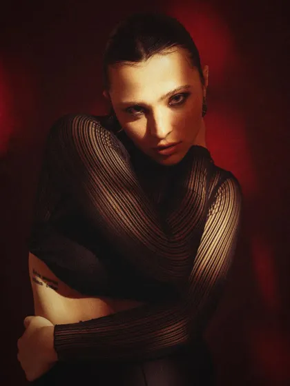 A moody and introspective portrait with dramatic lighting. The shadows create a sense of mystery, adding depth to an actor's portfolio.