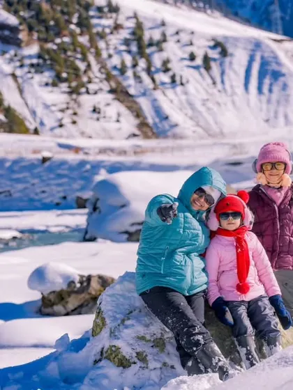 My kids enjoying the incredible snowy landscape of Kashmir. Family shoots on vacation are a wonderful way to document your shared adventures.