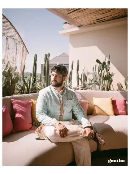 The groom relaxing on a colorful couch during his Bali Haldi ceremony, showcasing the comfortable and stylish lounge seating we arrange for guests.