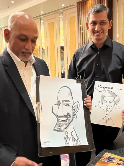 Two colleagues from the Sheraton event, each with their own unique caricature.