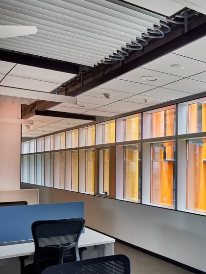 Inside the Infosys Nagpur campus, the colourful fins provide shading without obstructing views. This creates a pleasant and productive work environment with ample natural daylight, reducing the need for artificial lighting.