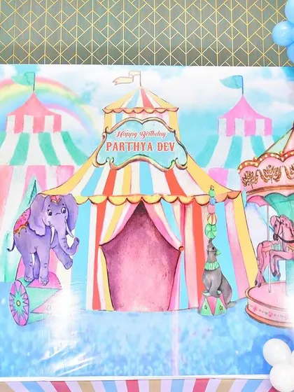 A close-up of the carnival theme's custom-printed backdrop.