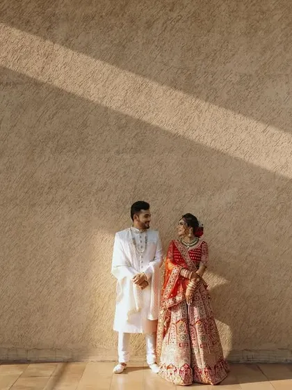 A wide shot using the lines of shadows to create a dramatic and artistic composition for this couple's portrait.
